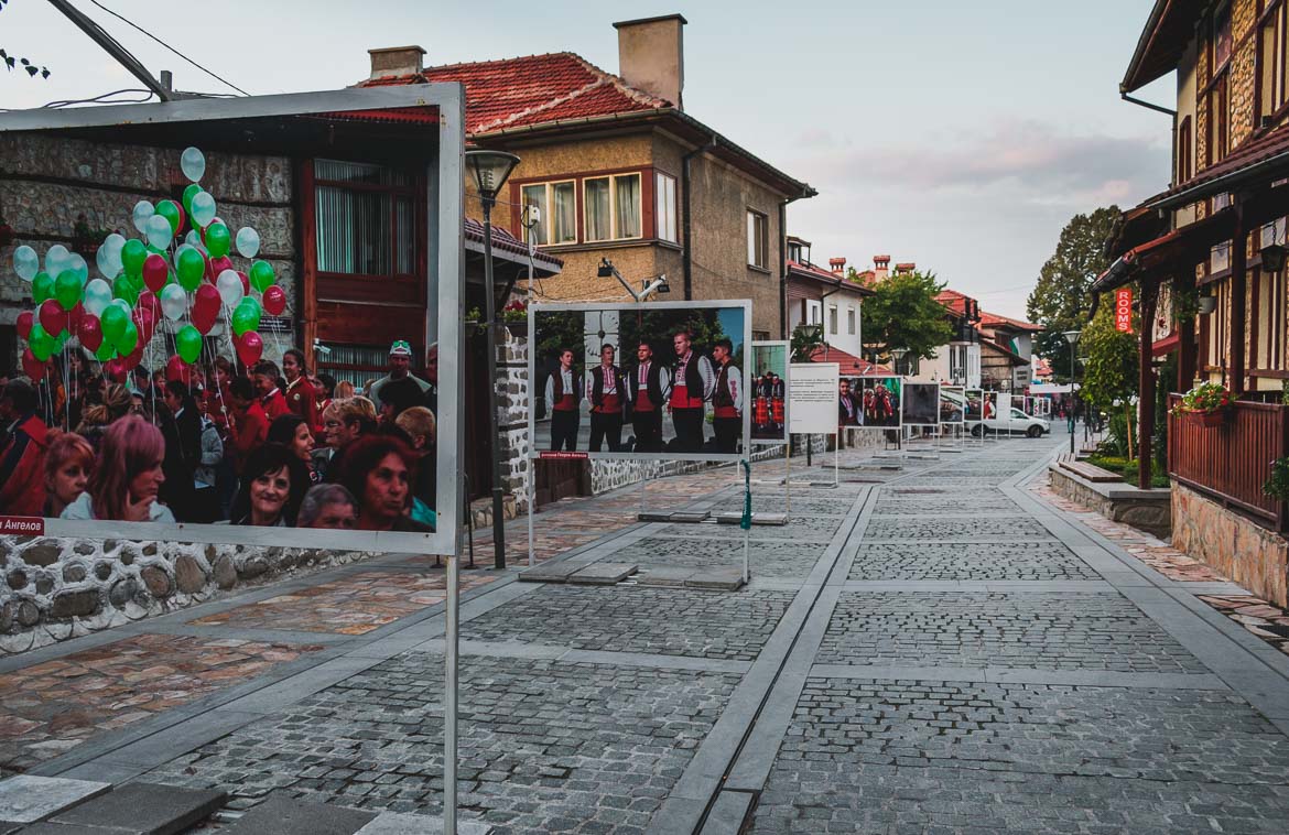 This photo shows Pirin Street which is the main street in Bansko Bulgaria. Hoppa airport transfers. How to get from Sofia to Bansko Bulgaria.