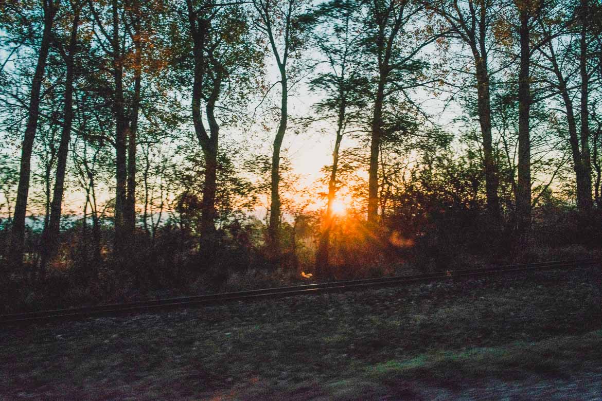 This is a photo of an idyllic landscape with railways in a forest we saw on our way from Sofia to Bansko. How to get from Sofia to Bansko Bulgaria.