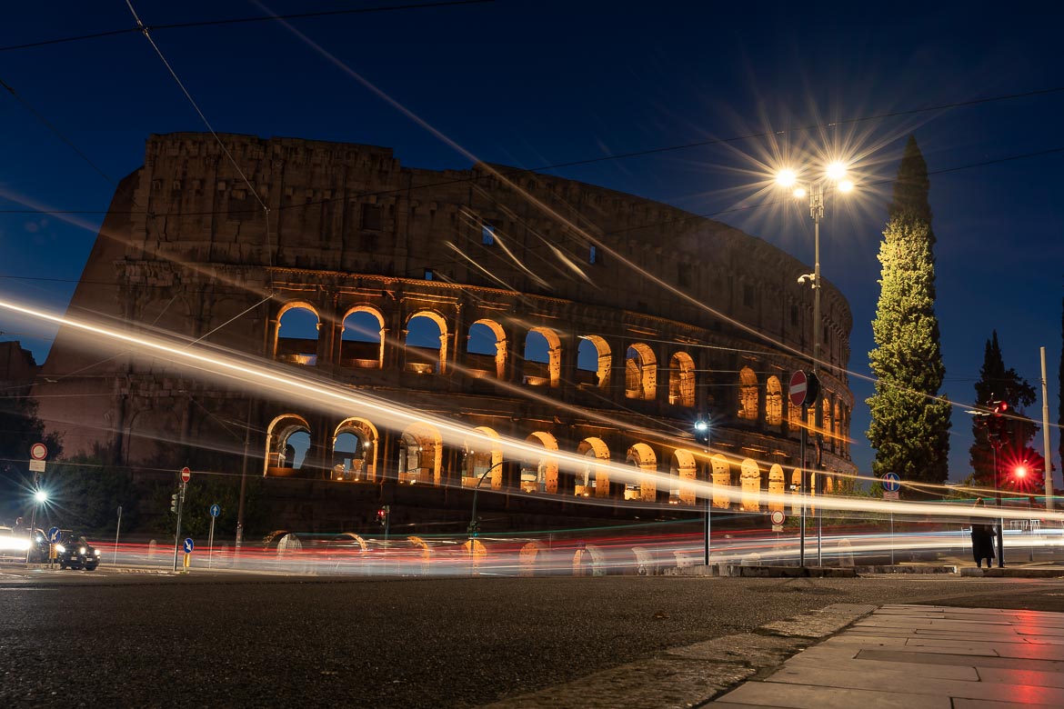 This is a long-exposure shot of the Colosseum with light trails. 