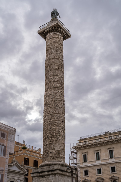 This is a close up of the Column of Marcus Aurelius in Piazza Colonna.