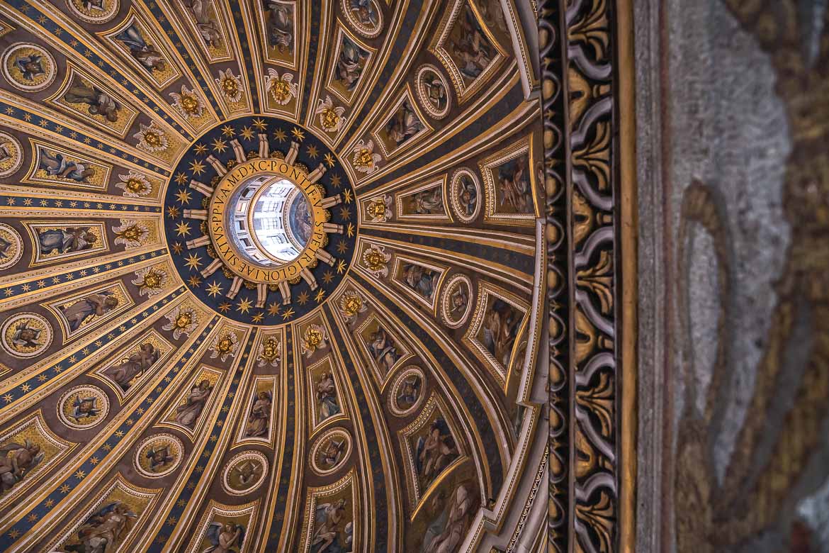 This is a close up of the mosaics inside St. Peter's Dome. The main colours are gold and blue and various forms are depicted, such as angels etc.