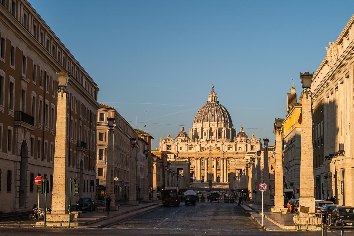 This image shows the view of St. Peter's Basilica from Via della Conciliazione early in the morning.