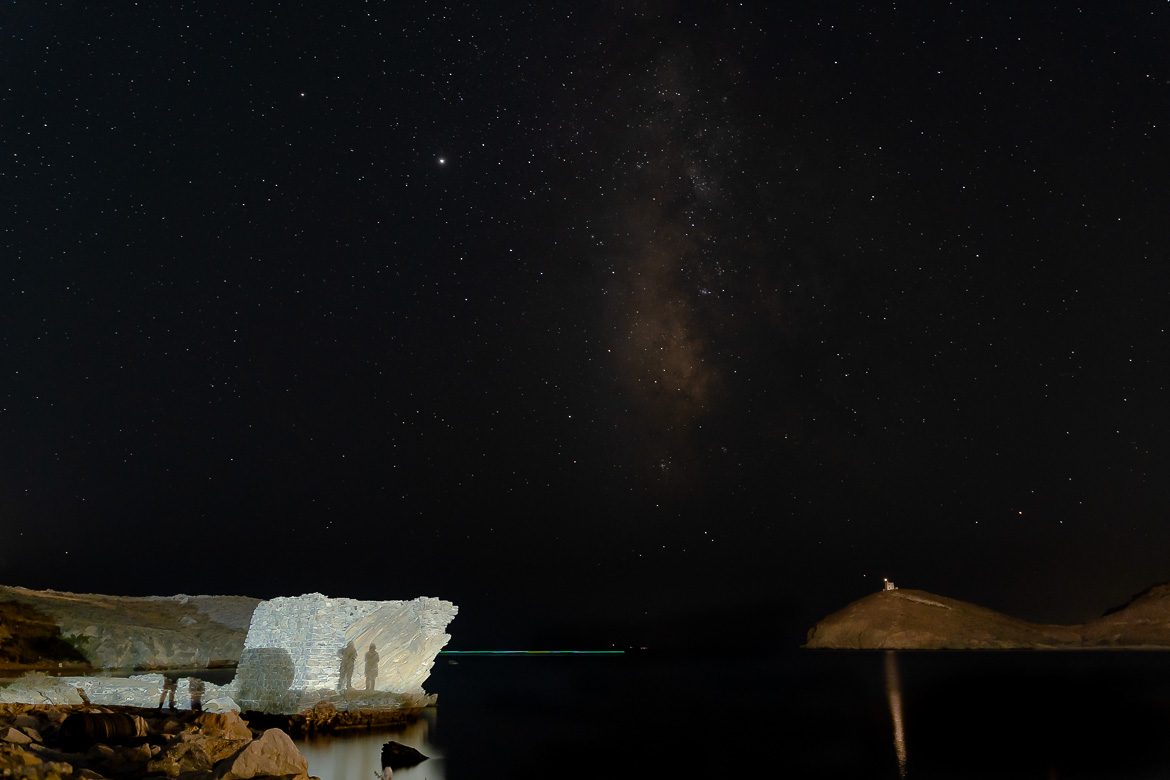 This image shows Maria and Katerina's shadows on a lit wall under a black starry sky.