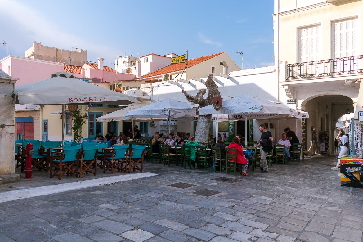 This image shows Kairis Square in Chora Andros, a picturesque square where people hang out at the traditional cafes. 