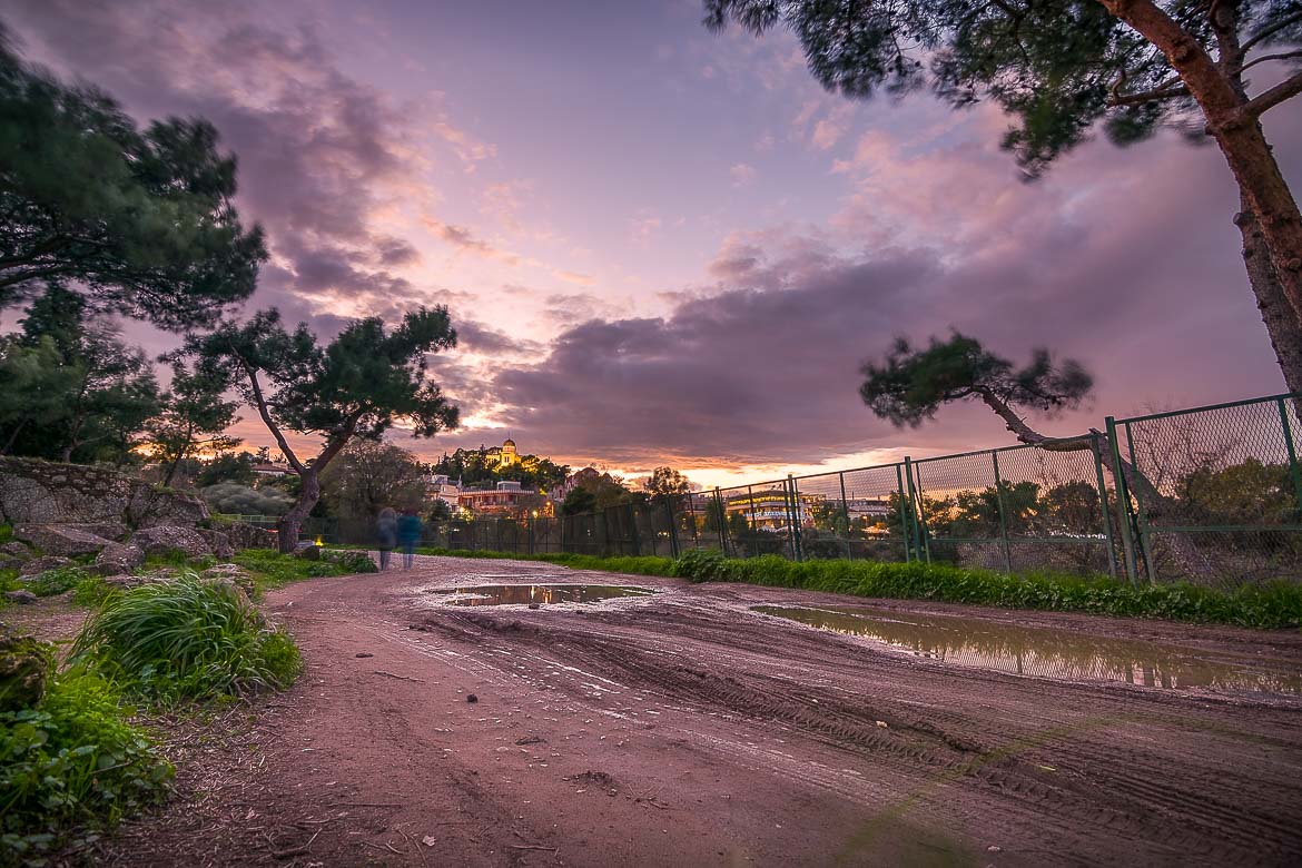 This image shows the path that starts from Plaka and ends at Apostolou Pavlou street in Thisseio. It was taken after a rain during sunset and in the background there is the National Observatory of Athens.