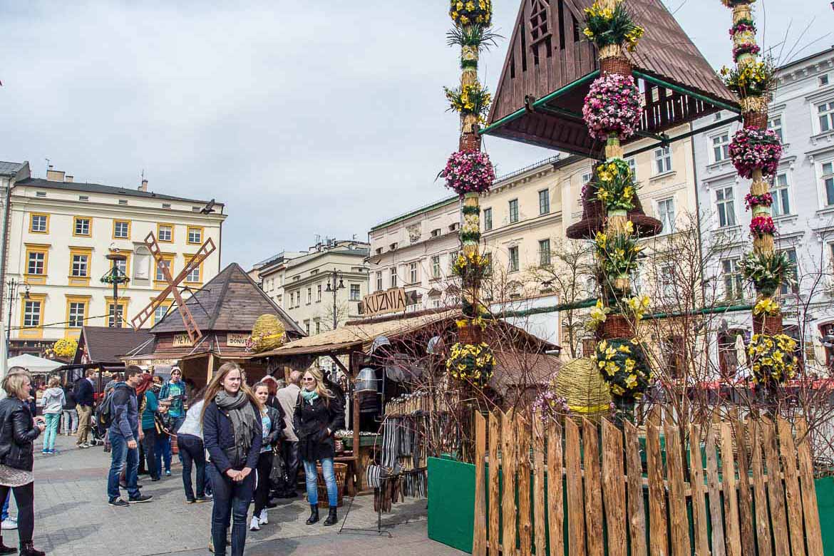 This is the main square in Krakow Old town at Easter. There are Easter decorations ana many people walking around.
