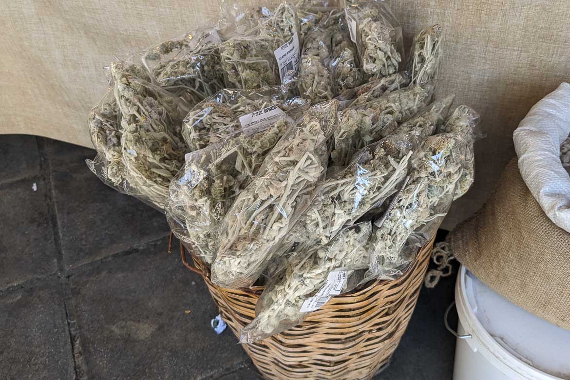Packets of mountain tea in a straw basket.
