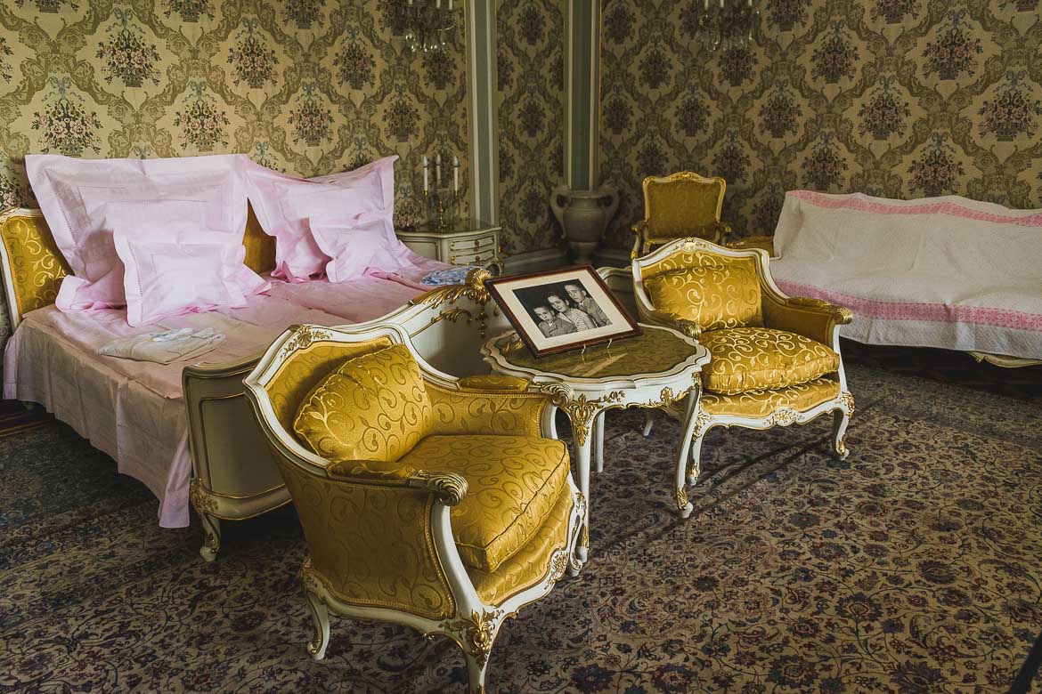 This photo shows the bedroom of Elena and Nicolae Ceausescu, one of the most impressive rooms in Ceausescu residence, Bucharest, Romania. The bed is made as if the couple are about to go to sleep.