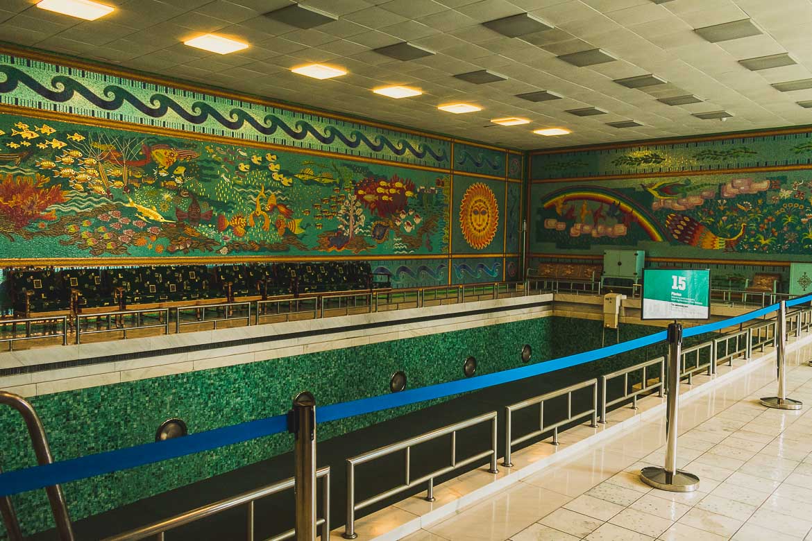 This photo shows the interior swimming pool at Ceausescu residence in Bucharest, Romania. The surrounding walls are decorated with incredible mosaics.