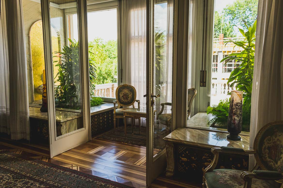 This photo shows large French doors opening to a sunny terrace in Ceausescu residence, Bucharest, Romania.