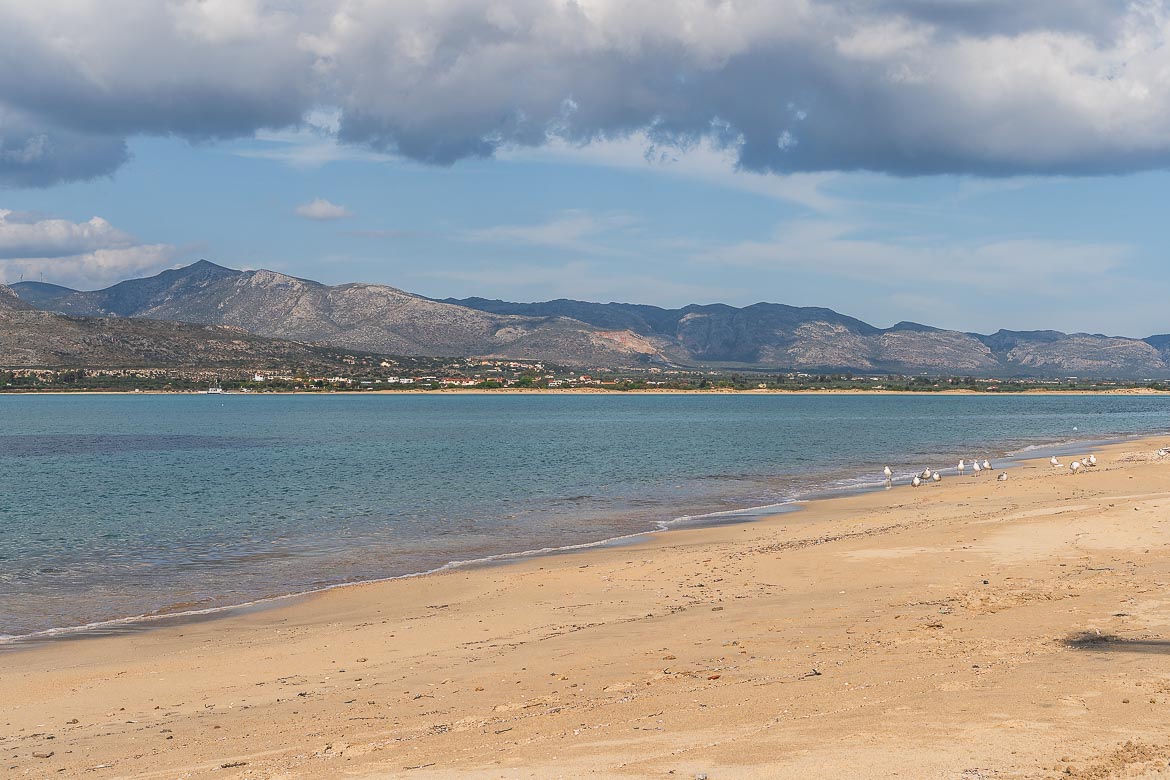 Panoramic shot of Kontogoni, the most underrated beach in Elafonisos Greece. The coast of Lakonia is visible in the background. 