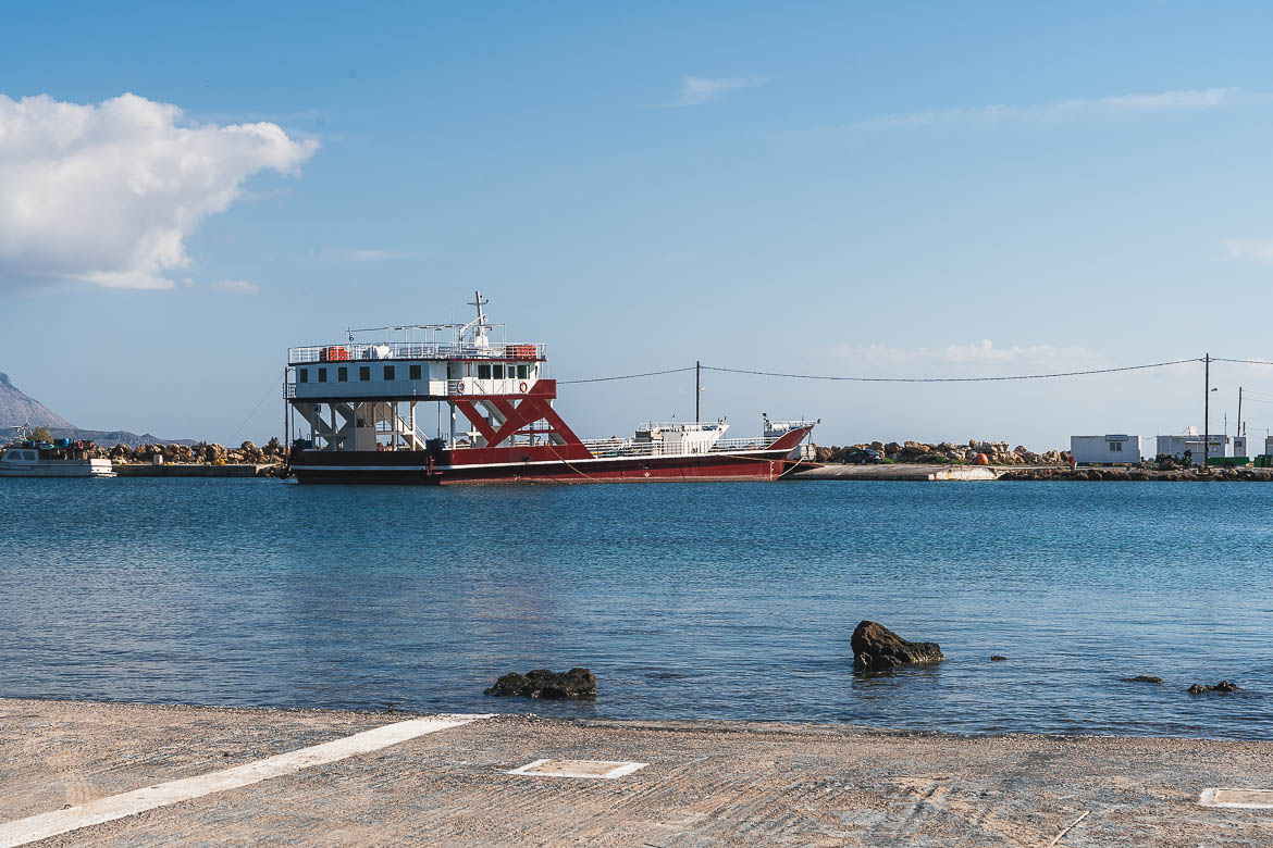 This image shows a red ferry anchored at Elafonisos port. 
