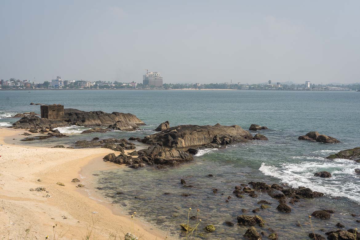 The sandy beach below the Aurora Bastion. A pillbox is built on a rock.