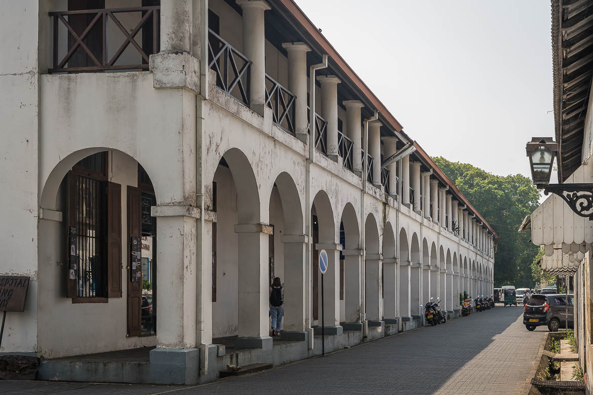 The facade of the Old Dutch Hospital, one of the best places to see in Galle. The two-storey building has a colonnade on each floor.