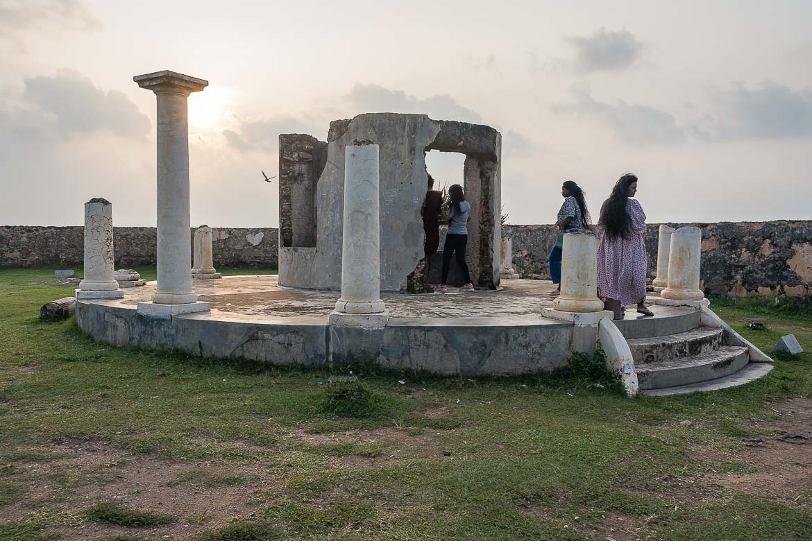 Remains of the naval signal station of Neptune Bastion. Locals are wandering around the circular colonnaded structure.