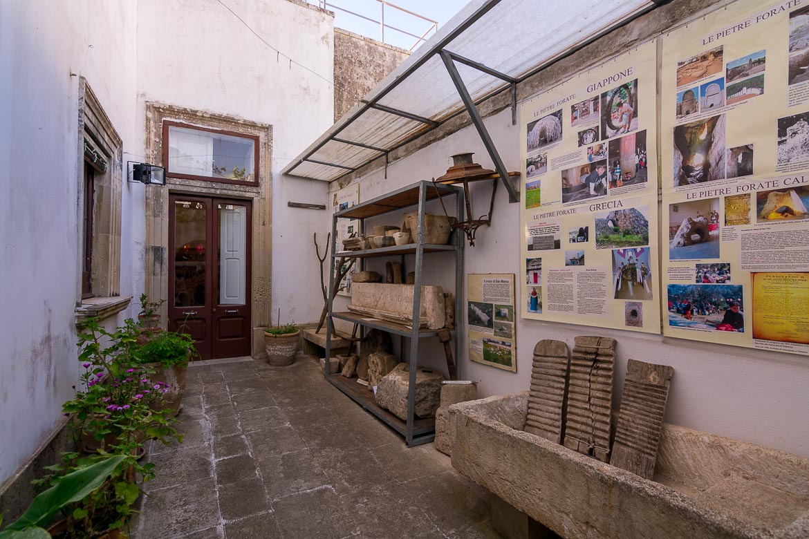 This photo shows the courtyard of the building that houses the museum in Calimera. There are some informative boards as well as some ancient relics on display. 