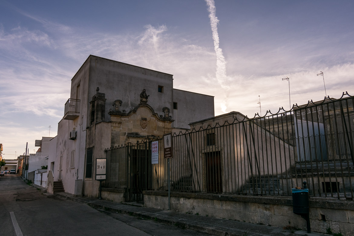 This photo shows the outside of the Crypt of Santa Cristina at sunset. 