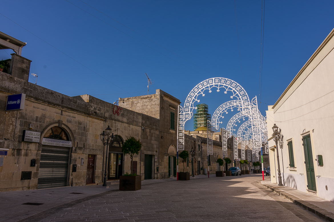 This photo shows the main street that runs along the historical centre at Castrignano de Greci. It is siesta time so all stores are closed. 