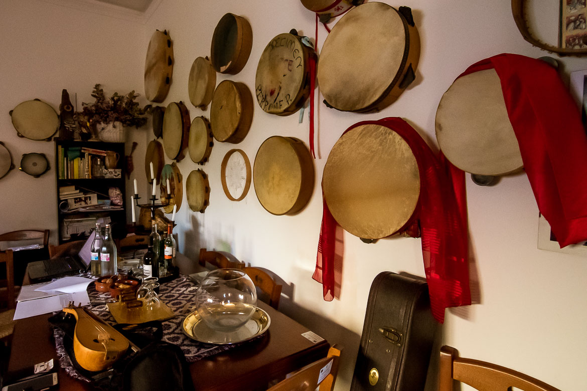This photo shows a wall filled with tambourines of all sizes and styles. This wall is at the Cultural Centre of Melpignano.
