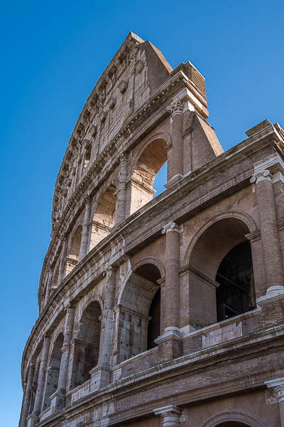 The facade of the Colosseum with its Ionic and Corinthian columns.
