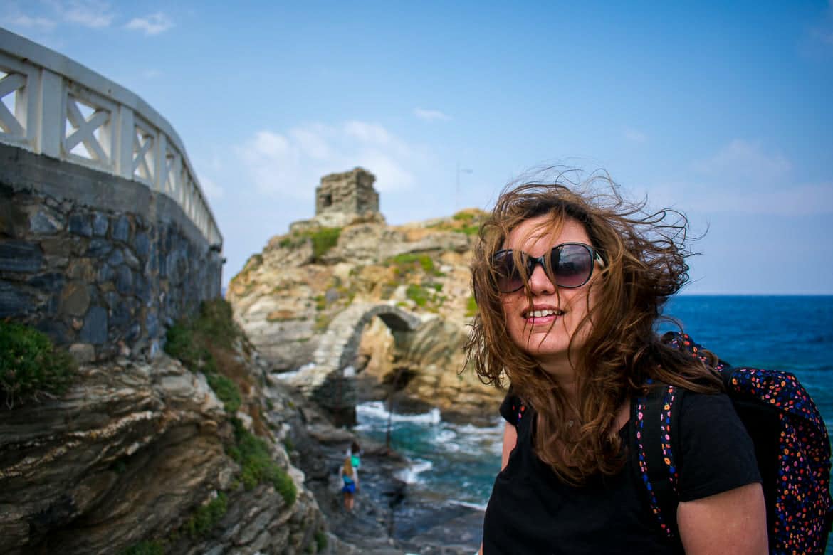This photo shows Maria smiling happily on a windy day in Chora, Andros, Cyclades, Greece.