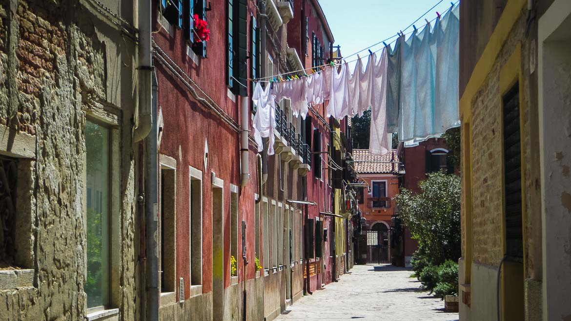 This is a photo of the island of Murano in Veneto, Italy. Window shops are filled with beautiful creations made of Murano glass. Venice Islands the perfect Venice day trip.