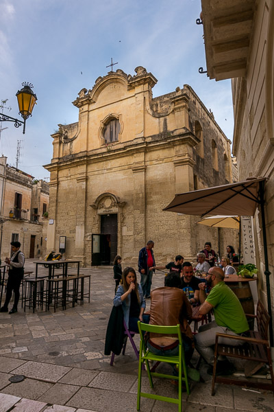 This is a photo of Piazzetta Chiesa Greca in Lecce. It is dotted with cosy cafes and bars.