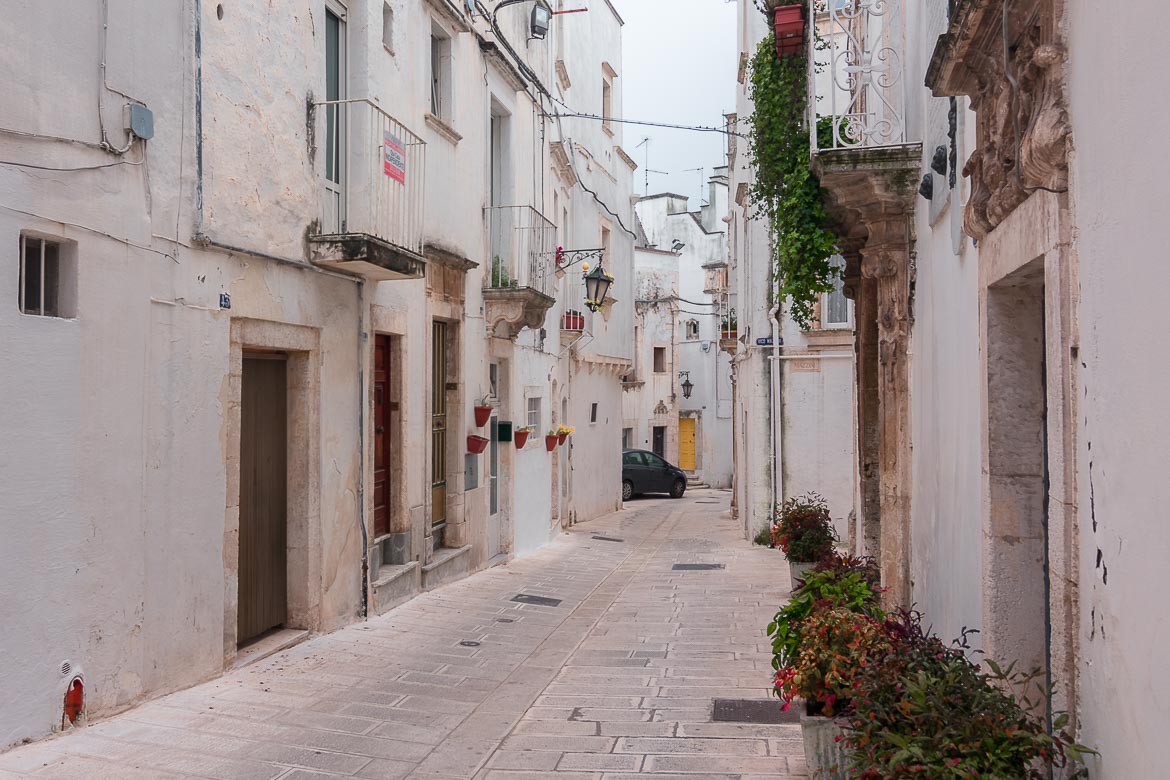 This image shows the historic centre of Martina Franca. There is a car in the background.