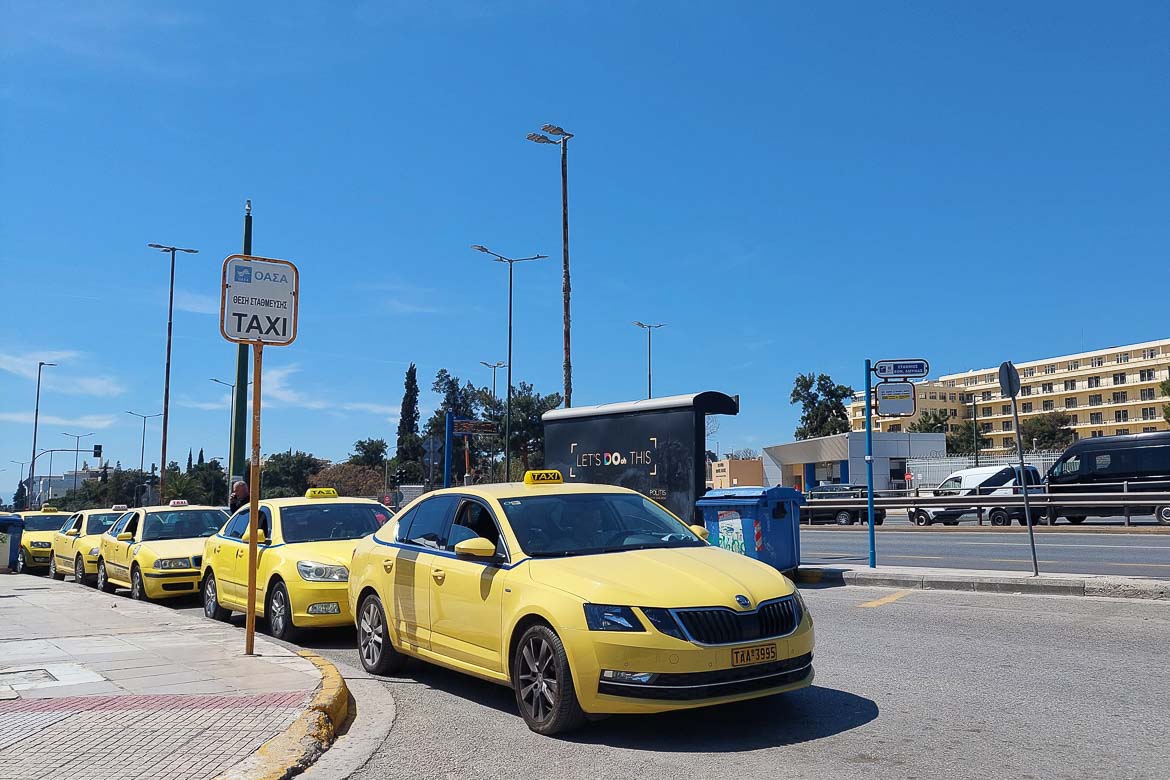 Yellow taxis waiting for a ride on Mesogeion Avenue in Athens.