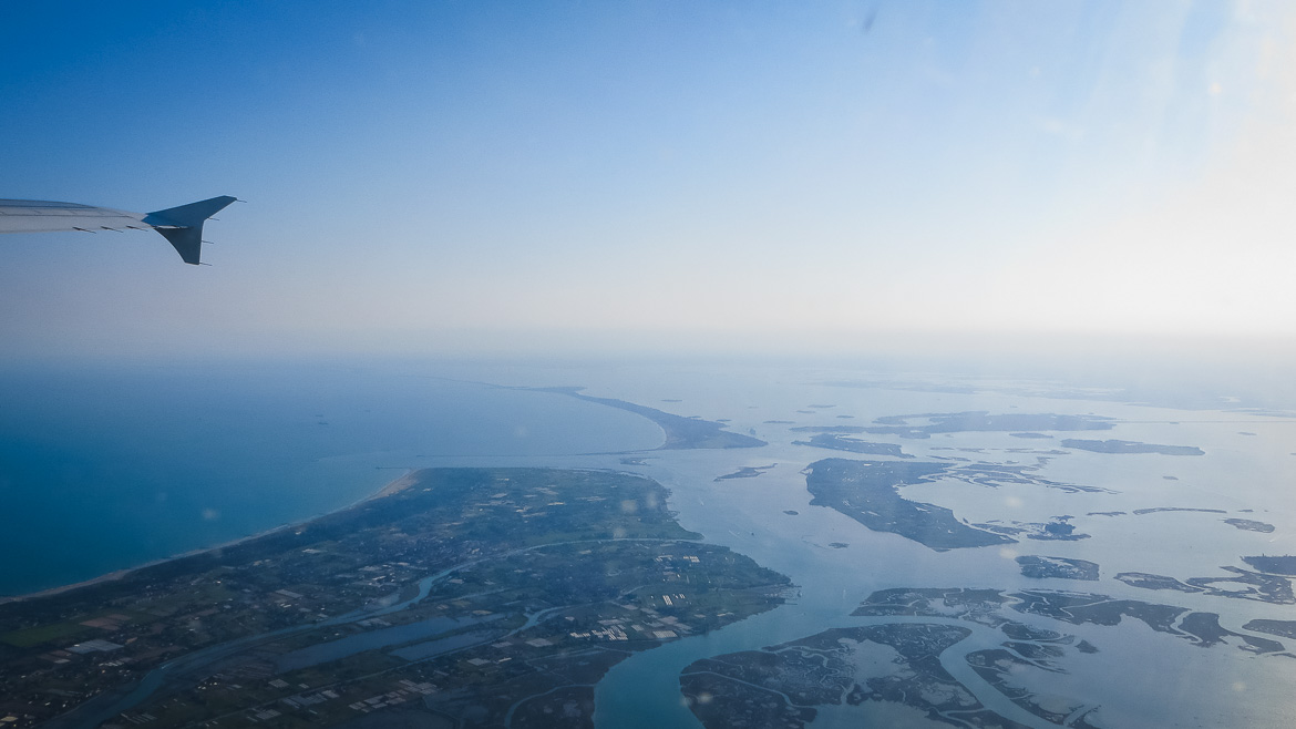 This is a photo of the Venetian Lagoon taken from the plane. Venice Islands. The perfect Venice day trip. Veneto Italy.