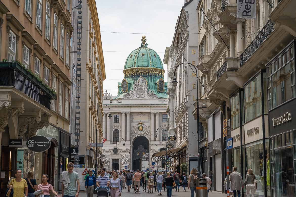 This image shows a busy street in Vienna with the Hofburg Palace in the background. If you're seeing Vienna in 3 days, Hofburg is an essential stop. 