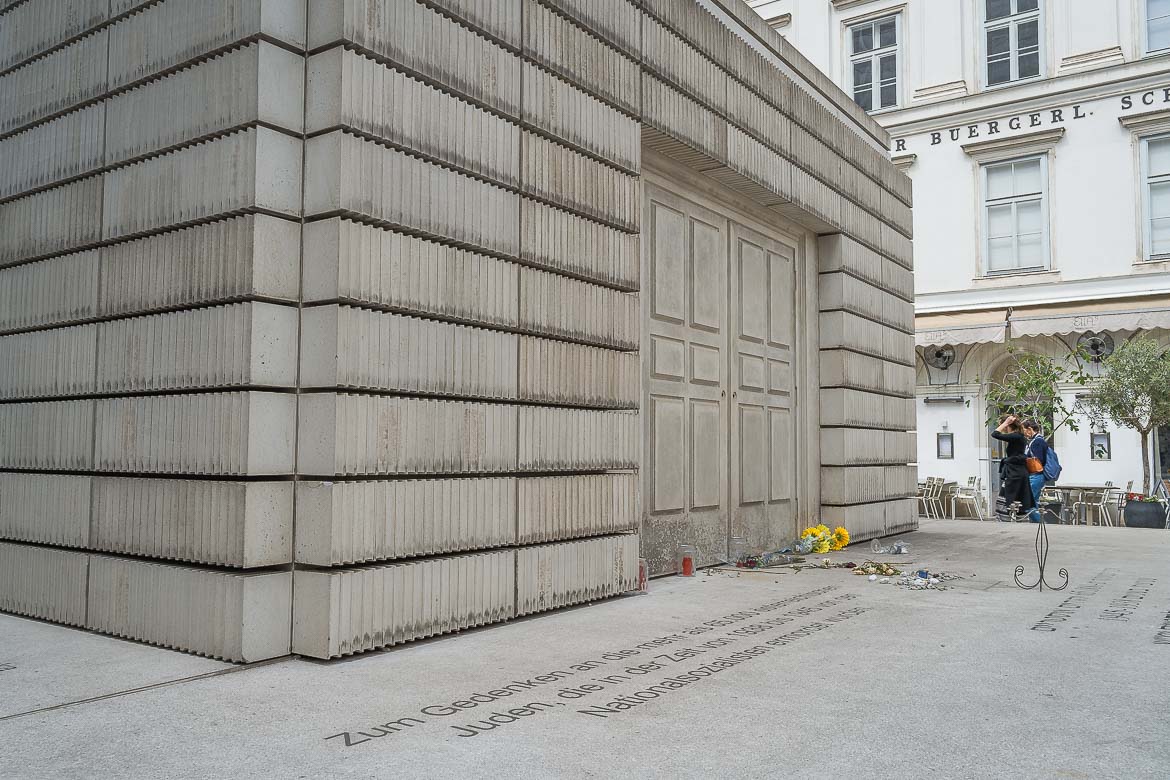 One of the Holocaust Memorial's facades with flowers in front of the entrance.