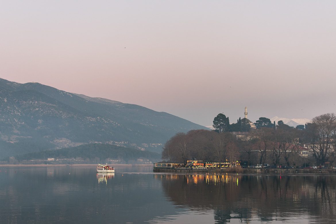 This is a panoramic shot of Ioannina Lake in the afternoon of a cold winter day. The ferry going to the island and the lights from cafes on the shore create perfect reflections on the tranquil waters. This photo shows the utter beauty of Ioannina city. 