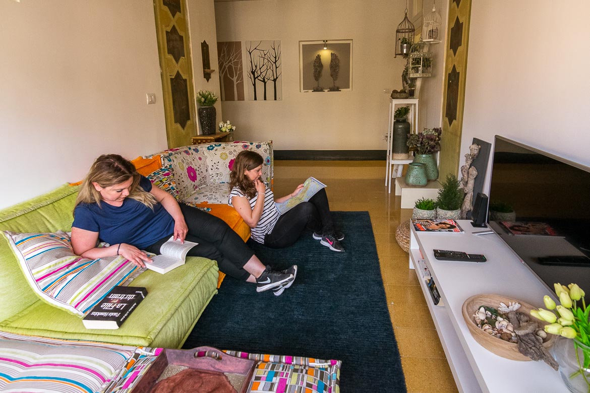 This photo shows Maria reading a book and Katerina studying a map. They are sitting at the former chapel sitting area at Palazzo Bignami. 