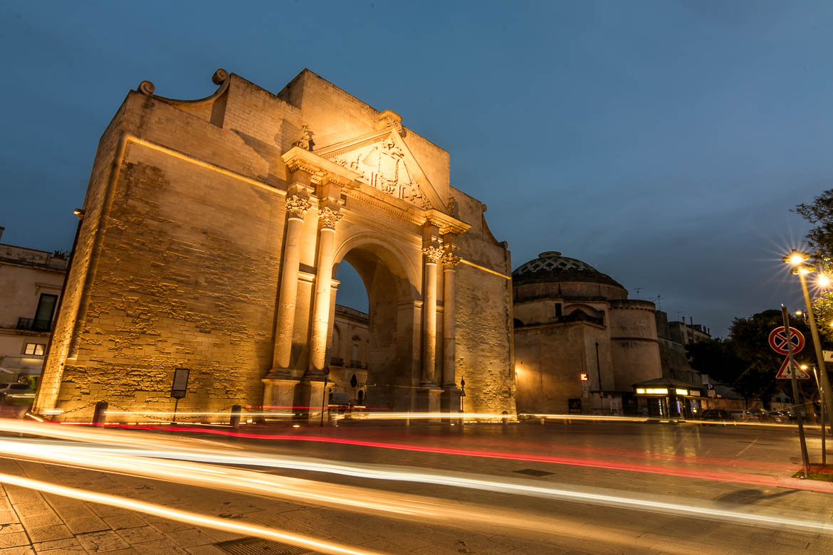 This is a long exposure shot of Porta Napoli in Lecce, Italy in the evening. 