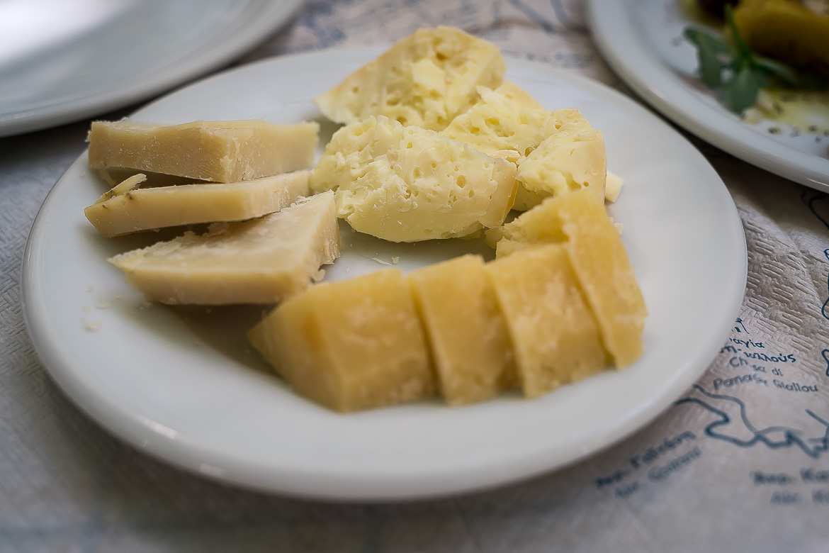 This image is a closeup of a plate with arseniko cheese and other types of cheese.