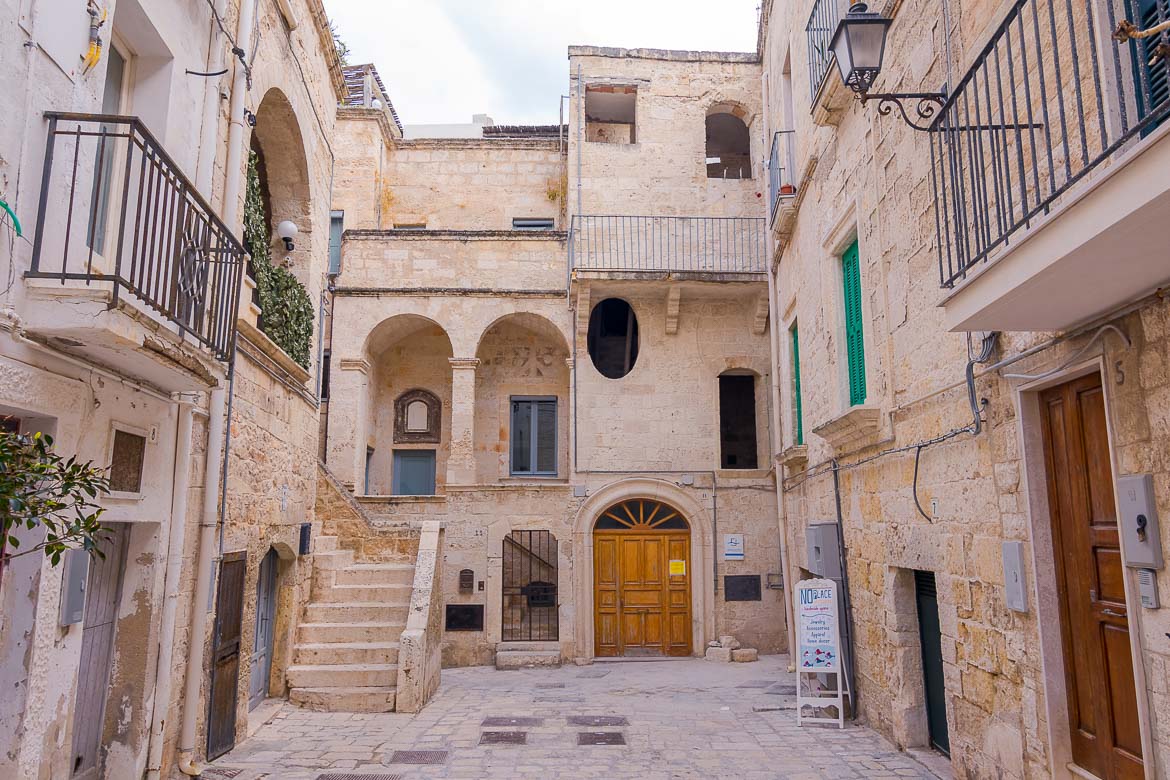 This is a photo of a courtyard in the Old Town. There are gorgous old buldings and there isn't anyone around.