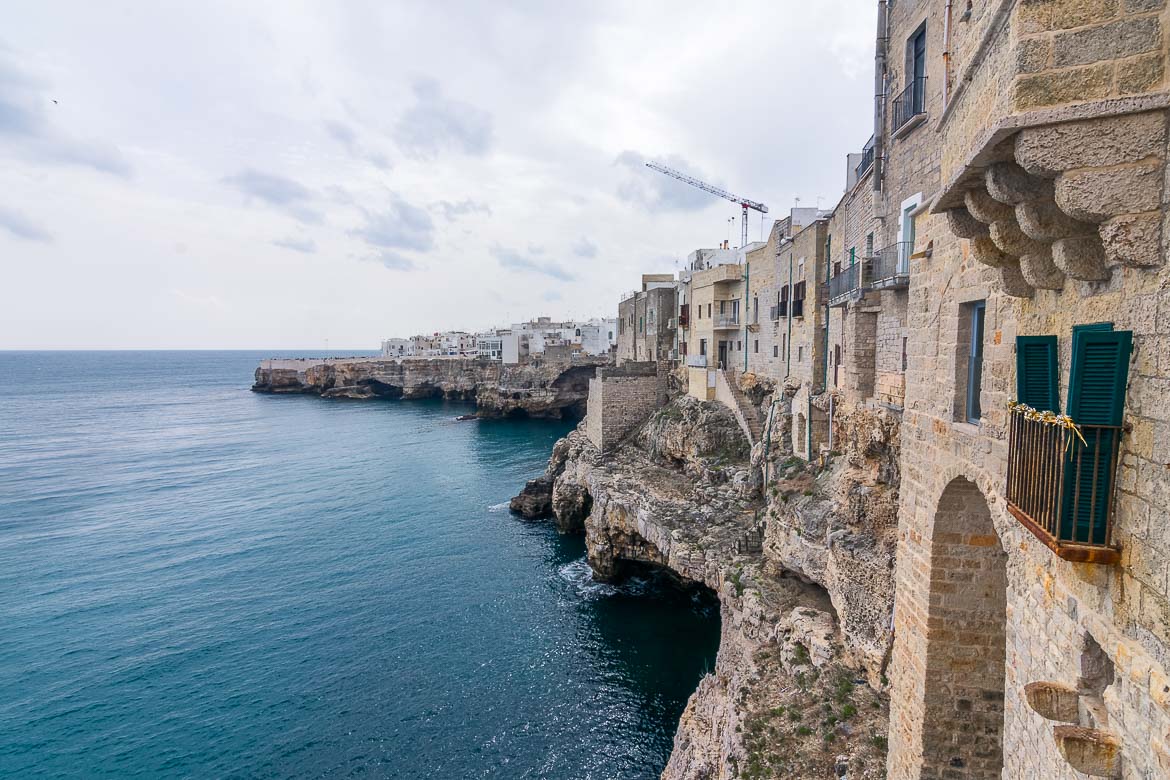 This is a photo of the old town hanging on the cliff above the sea. The bulidings are carved on the rock and they face the Adriatic Sea beyond. At the foot of the cliff there are numerous sea caves. 