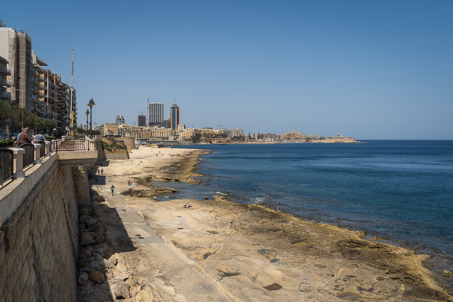 View of Sliema's rugged beach from the promenade.