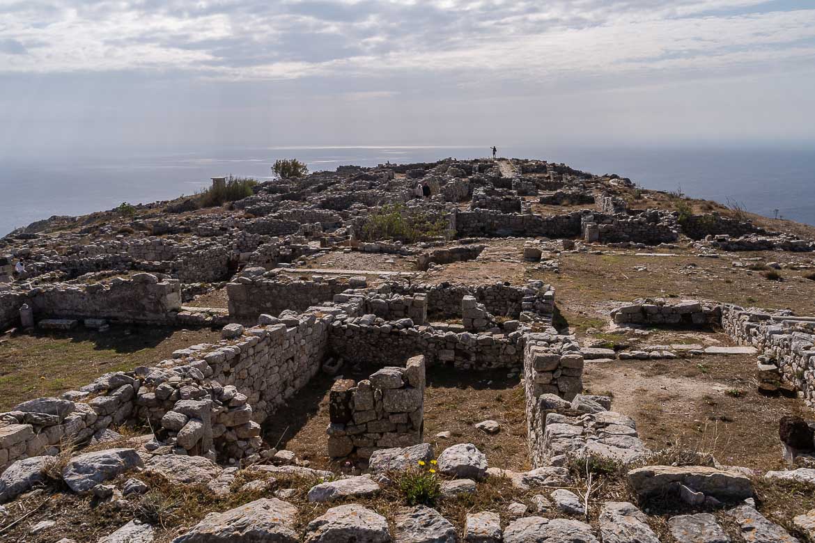 This image shows ancient ruins scattered across a hilltop, on the site where Ancient Thera used to be.